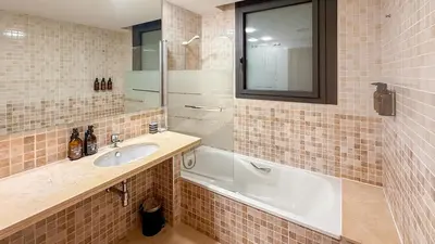 a bathroom with a sink and a bath tub at Villa Marina in Sitges