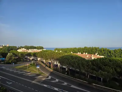 an overhead view of a highway with trees and houses at Aquamarina Apt | Seaviews | 1' beach | Family in San Pol de Mar