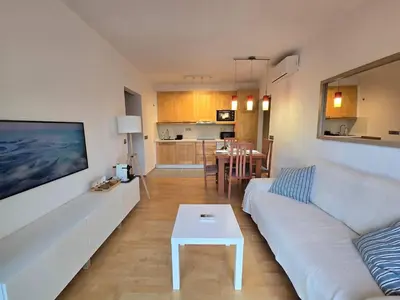 a balcony with chairs and a view of the ocean at Aquamarina Apt | Seaviews | 1' beach | Family in San Pol de Mar