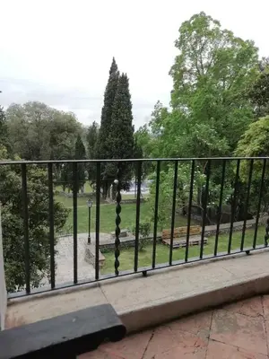 a fence with a view of a park at Hostal Rural Mas Blanc in San Martín de Centellas