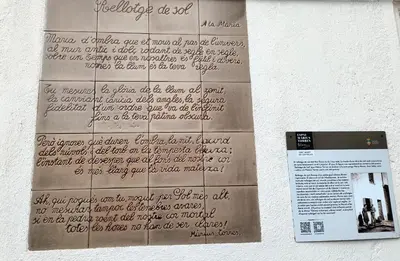 a paper with writing on the side of a wall at Hostal Rural Mas Blanc in San Martín de Centellas