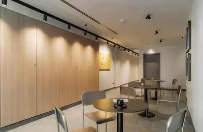 a restaurant with tables and chairs in a room at Lixar's apartment in Hospitalet de Llobregat