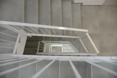 a stairwell with a mirror in a room at Hotel Plini in Hospitalet de Llobregat