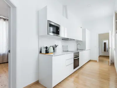 a microwave oven sitting on top of a counter at Canela Homes MIDTERM MARINA in Barcelona