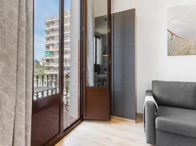 a kitchen counter with a coffee maker and a plant at Canela Homes MIDTERM MARINA in Barcelona