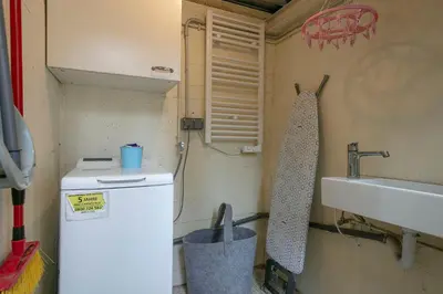 a small kitchen with a sink and a refrigerator at Winahost Apartament Cirerer in Valldoreix