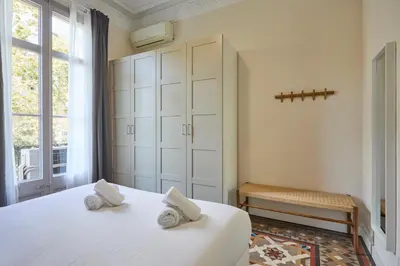 a bedroom with two white beds and a window at 12DIA1008 - Fantastic Apartment in Diagonal in Barcelona