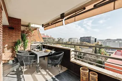 a balcony with a table and chairs and a view at Montseny - 2 bedroomd and terrace in Montseny in Barcelona