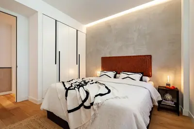 a dining room with a table and a mirror at Tinghir - 2 bedrooms and pool in Gràcia in Barcelona