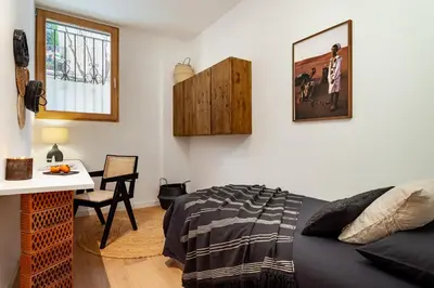 a bathroom with a sink and a mirror at Tinghir - 2 bedrooms and pool in Gràcia in Barcelona
