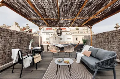 a bedroom with a large bed and a mirror at Atacama - 1 bedroom in Eixample Esquerra in Barcelona