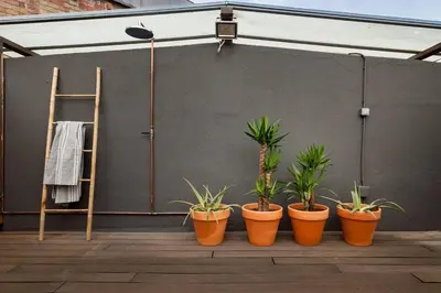 a refrigerator in a room with a curtain at Atacama - 1 bedroom in Eixample Esquerra in Barcelona