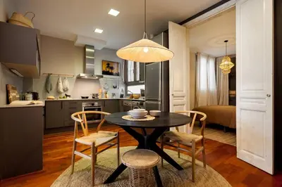 a living room with a fireplace and a tv at Atacama - 1 bedroom in Eixample Esquerra in Barcelona