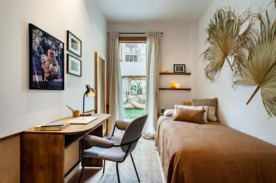 a living room with a couch and a table at Pasir - 2 bedrooms and terrace in Gràcia in Barcelona