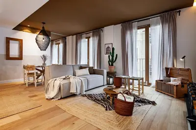 a bedroom with a large bed and a large window at Tenere - 1 bedroom and pool in Gràcia in Barcelona