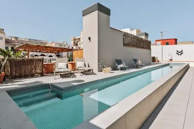 a swimming pool on the roof of a building at Tenere - 1 bedroom and pool in Gràcia in Barcelona