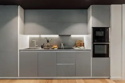 a living room with a couch and a kitchen at Mawun - 2 bedrooms in Gràcia in Barcelona