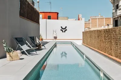 a swimming pool on the roof of a building at Oetune - 2 bedrooms and office in Gràcia in Barcelona