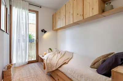 a living room with a couch and a table at Oetune - 2 bedrooms and office in Gràcia in Barcelona