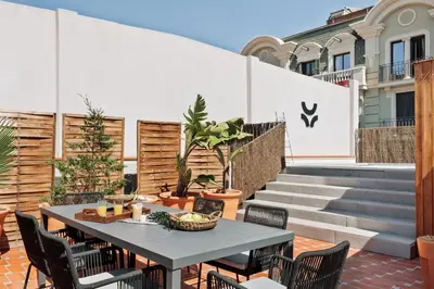 an outdoor patio with couches and a table at Sanur - 2 bedrooms in Gràcia in Barcelona