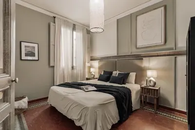 a small kitchen with a small table and chairs at Cotoca - 3 bedrooms and balcony in Eixample Dreta in Barcelona