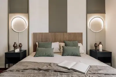 a bedroom with a large white bed and a table at Cotoca - 3 bedrooms and balcony in Eixample Dreta in Barcelona