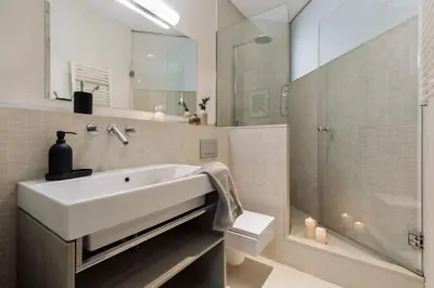 a bedroom with a bed with two mirrors on the wall at Cotoca - 3 bedrooms and balcony in Eixample Dreta in Barcelona