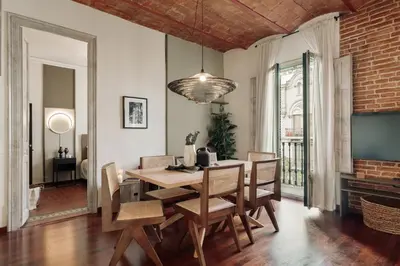 a dining room with a table and chairs at Cotoca - 3 bedrooms and balcony in Eixample Dreta in Barcelona