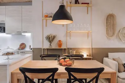 a kitchen with white cabinets and a white counter top at Velez - 1 bedroom in Gràcia in Barcelona