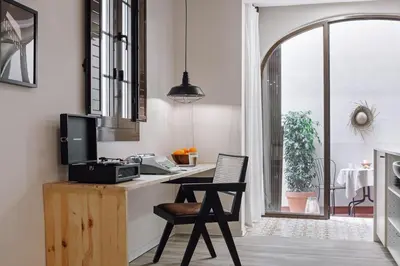 a bedroom with a large white cabinet and a mirror at Velez - 1 bedroom in Gràcia in Barcelona