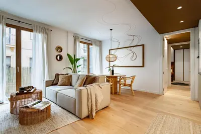 a bedroom with a bed and a desk and a chair at Mojo - 2 bedrooms in Gràcia in Barcelona