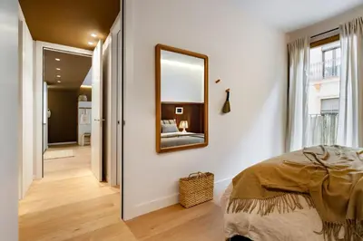 a living room with a couch and a table at Mojo - 2 bedrooms in Gràcia in Barcelona