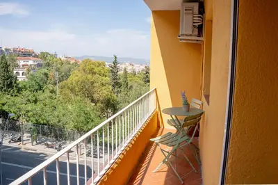 a balcony with a table and a view of a street at Apartamento - Recinto Modernista in Barcelona