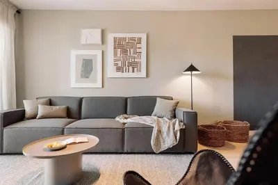 a living room with a couch and a table at Katz - 3 bedrooms and terrace in Les Corts in Barcelona