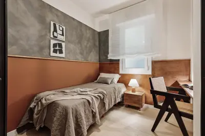 a living room with a table and a couch at Katz - 3 bedrooms and terrace in Les Corts in Barcelona