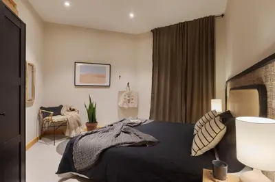 a bedroom with a large bed with two lamps at Amazzer - 3 bedrooms in Eixample Esquerra in Barcelona