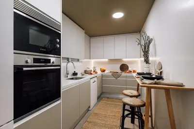 a kitchen counter with a plate of fruit on it at Laurel - 3 bedrooms in Sant Gervasi in Barcelona