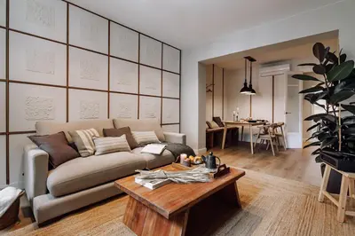 a living room with a couch and a table at Laurel - 3 bedrooms in Sant Gervasi in Barcelona