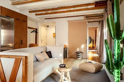 a bedroom with a bed and a large mirror at Shan - 1 bedroom and balcony in El Born in Barcelona