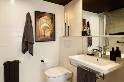 a living room with a couch and a table at Shan - 1 bedroom and balcony in El Born in Barcelona
