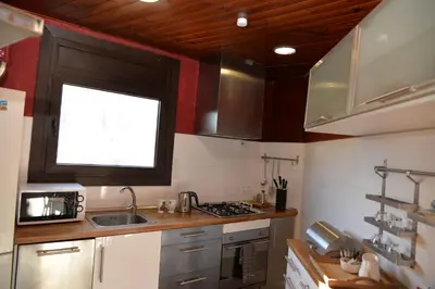 a small kitchen with a sink and a window at Barcelona Badalona tu refugio playa y metro in Badalona