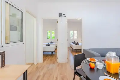 a living room with a couch and a table at Key Barcelona Sagrada Familia House Terrace in Barcelona