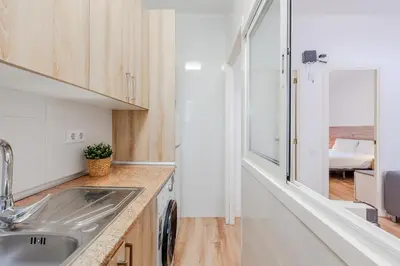 a small kitchen with a sink and a counter at Key Barcelona Sagrada Familia House Terrace in Barcelona