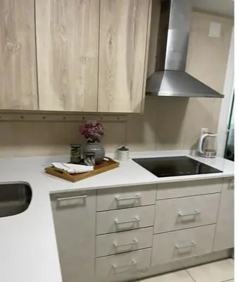 a kitchen with a sink and a counter top at Alojamiento espacioso ideal para visitas en grupo in Terrassa