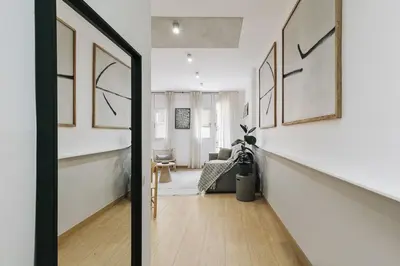 a bedroom with a bed with a book on it at Agnello - 3 bedrooms and office in Sant Gervasi in Barcelona
