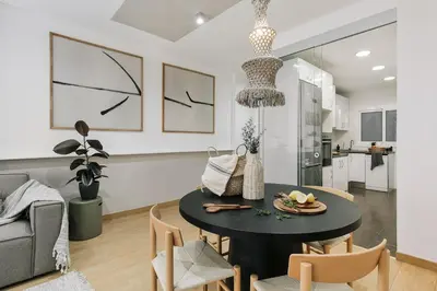 a living room with a couch and a chair at Agnello - 3 bedrooms and office in Sant Gervasi in Barcelona
