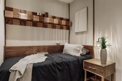 a living room with a couch and a kitchen at Bayal - 2 bedrooms and balcony in El Putxet in Barcelona