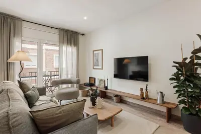 a bedroom with a bed with a tray with mugs at Briso - 3 bedrooms and balcony in Vila de Gràcia in Barcelona