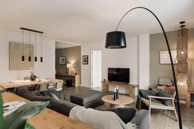 a bedroom with a large bed with a large headboard at Elan - 2 bedrooms and balcony in Sant Gervasi in Barcelona