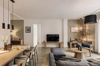 a living room with a couch and a table at Elan - 2 bedrooms and balcony in Sant Gervasi in Barcelona